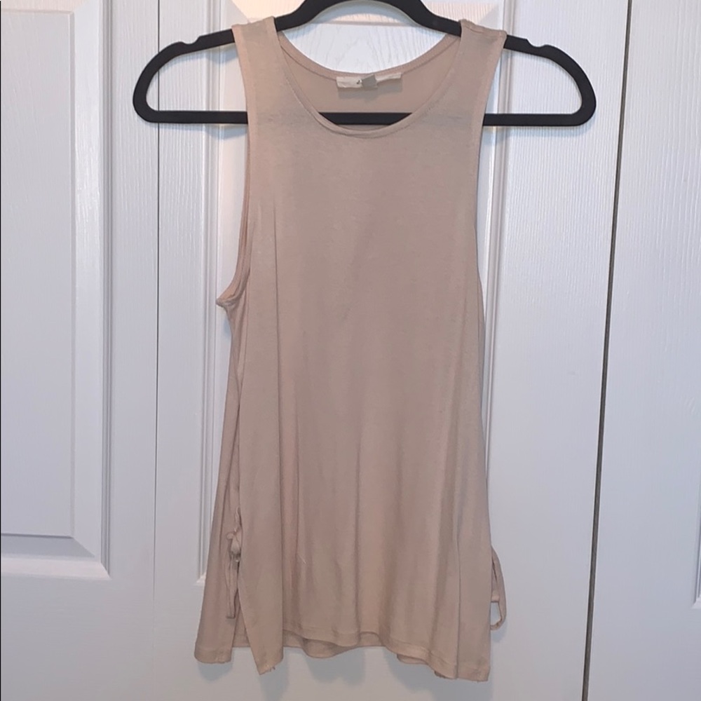 Cute cream top with ties on each side.